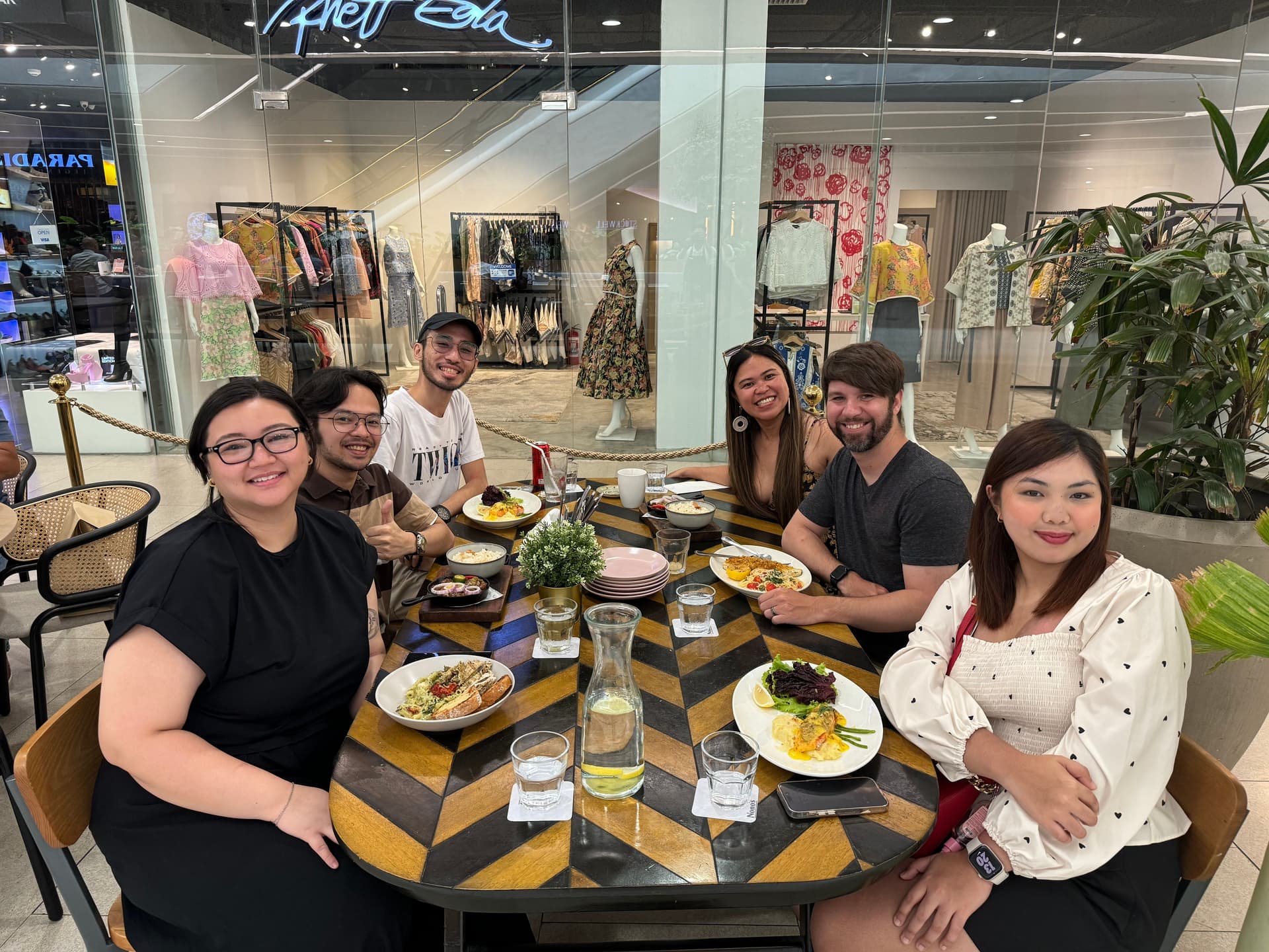 Kristy, James, and team members at a team dinner