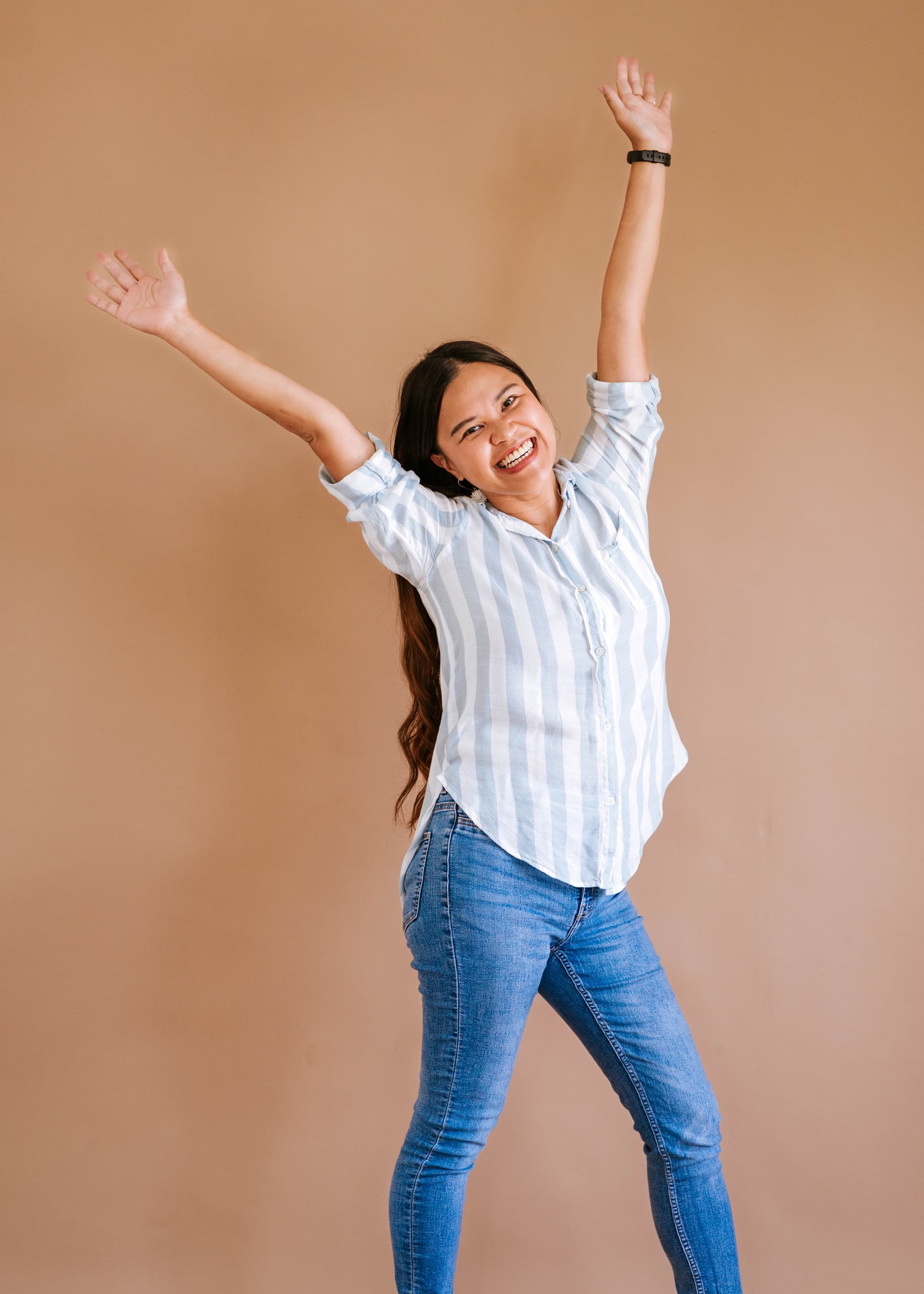 Kristy Yoder joyfully raising her arms